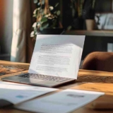 This image shows an open laptop on an office table, Comprehensive Guide to CV Format Word, Resume Template Word Free Download.